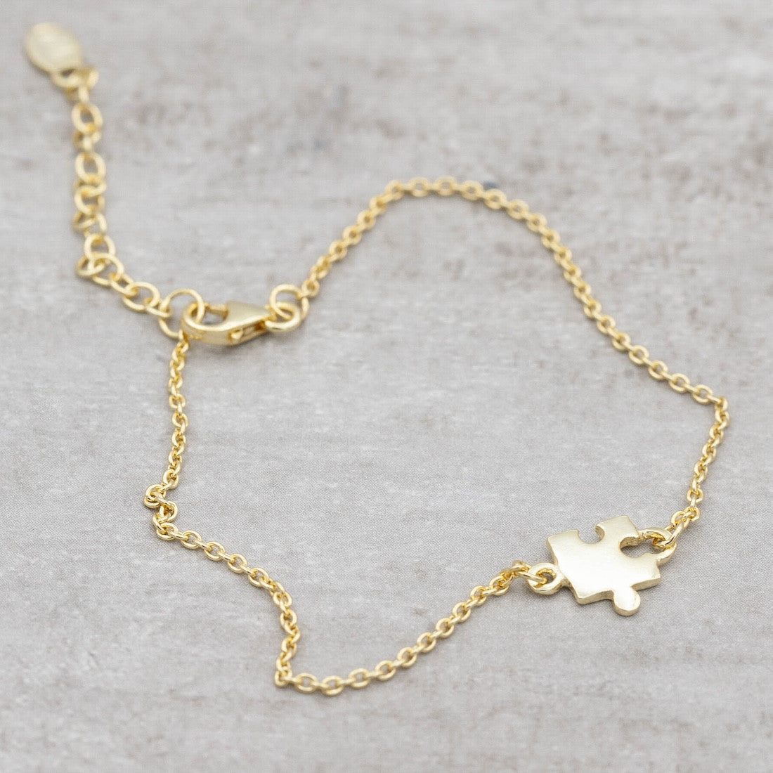Armband pusselbit guld
