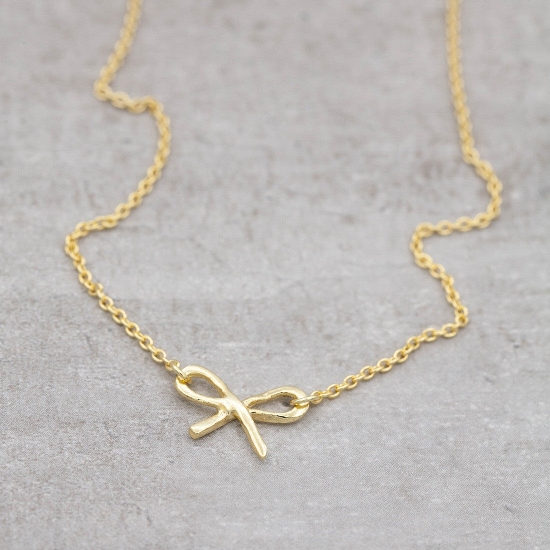 Halsband i guld rosett