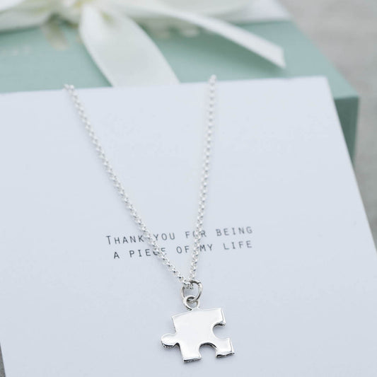 Silverhalsband pusselbit